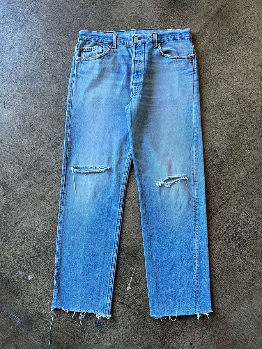 1990s Levi's 501 Faded Blue Raw Hem Jeans 34