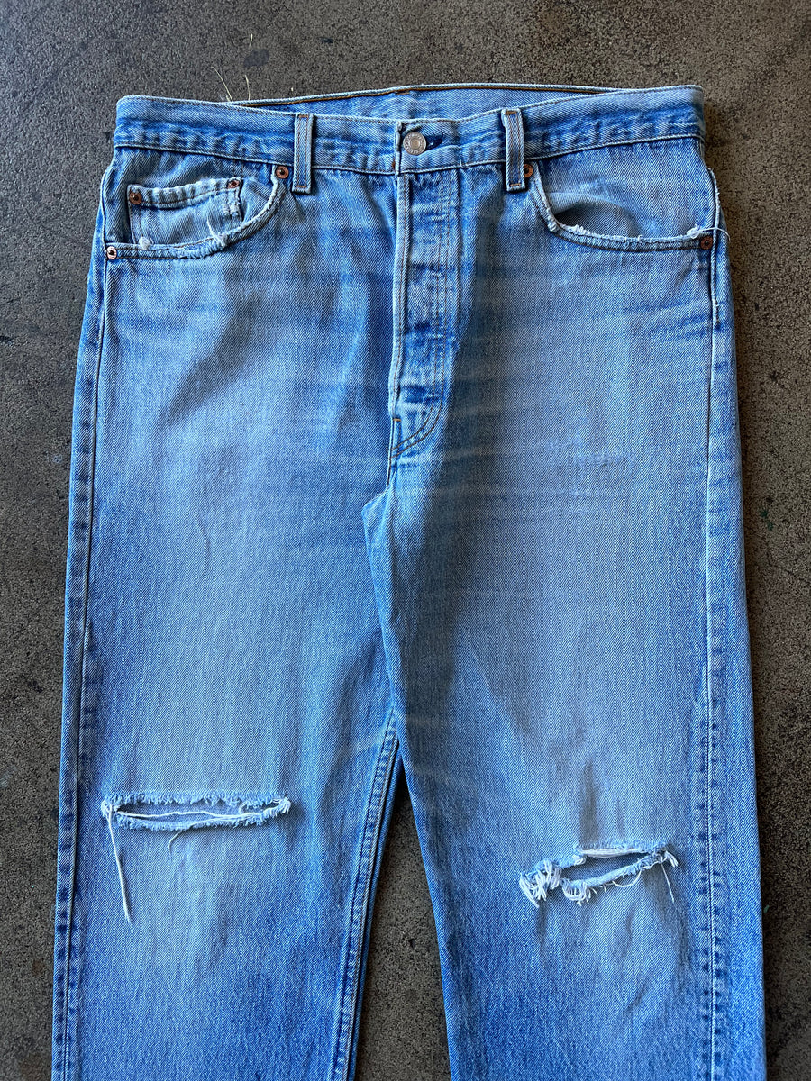 1990s Levi's 501 Faded Blue Raw Hem Jeans 34