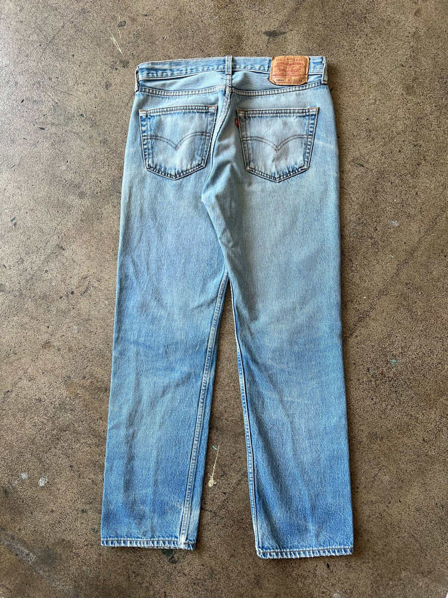 Early 2000s Levi's 501xx Faded + Distressed Jeans 31