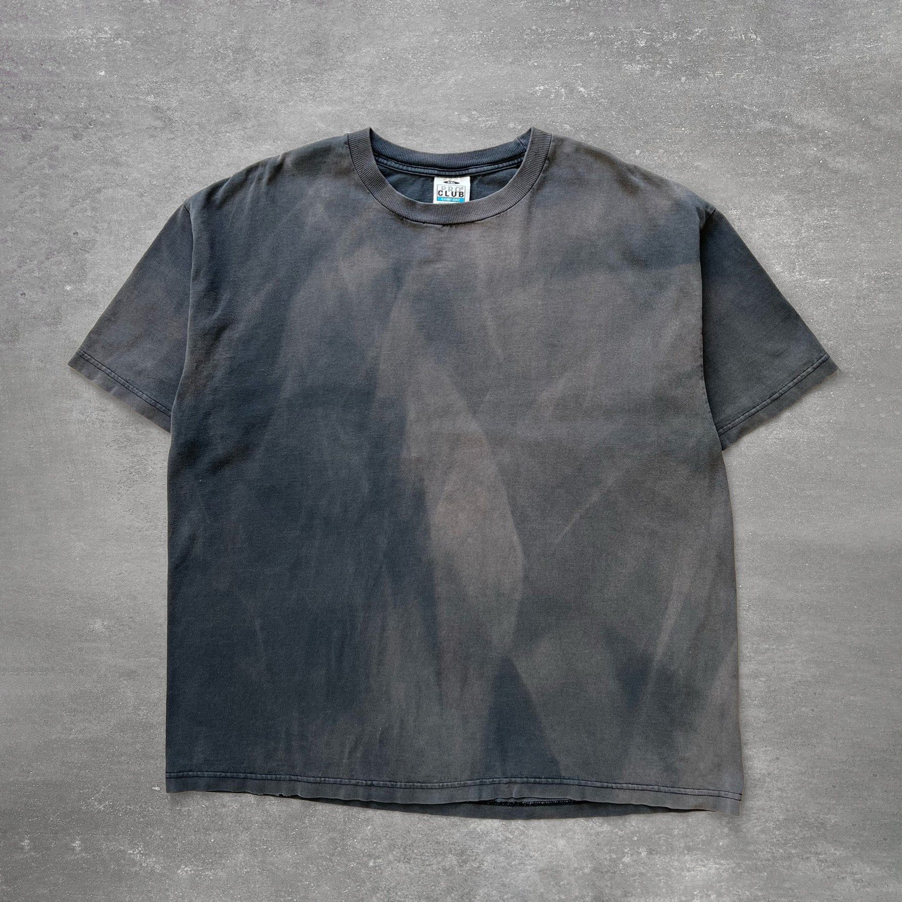 1990s black cotton T-shirt with strong natural sun fading and tonal variation
